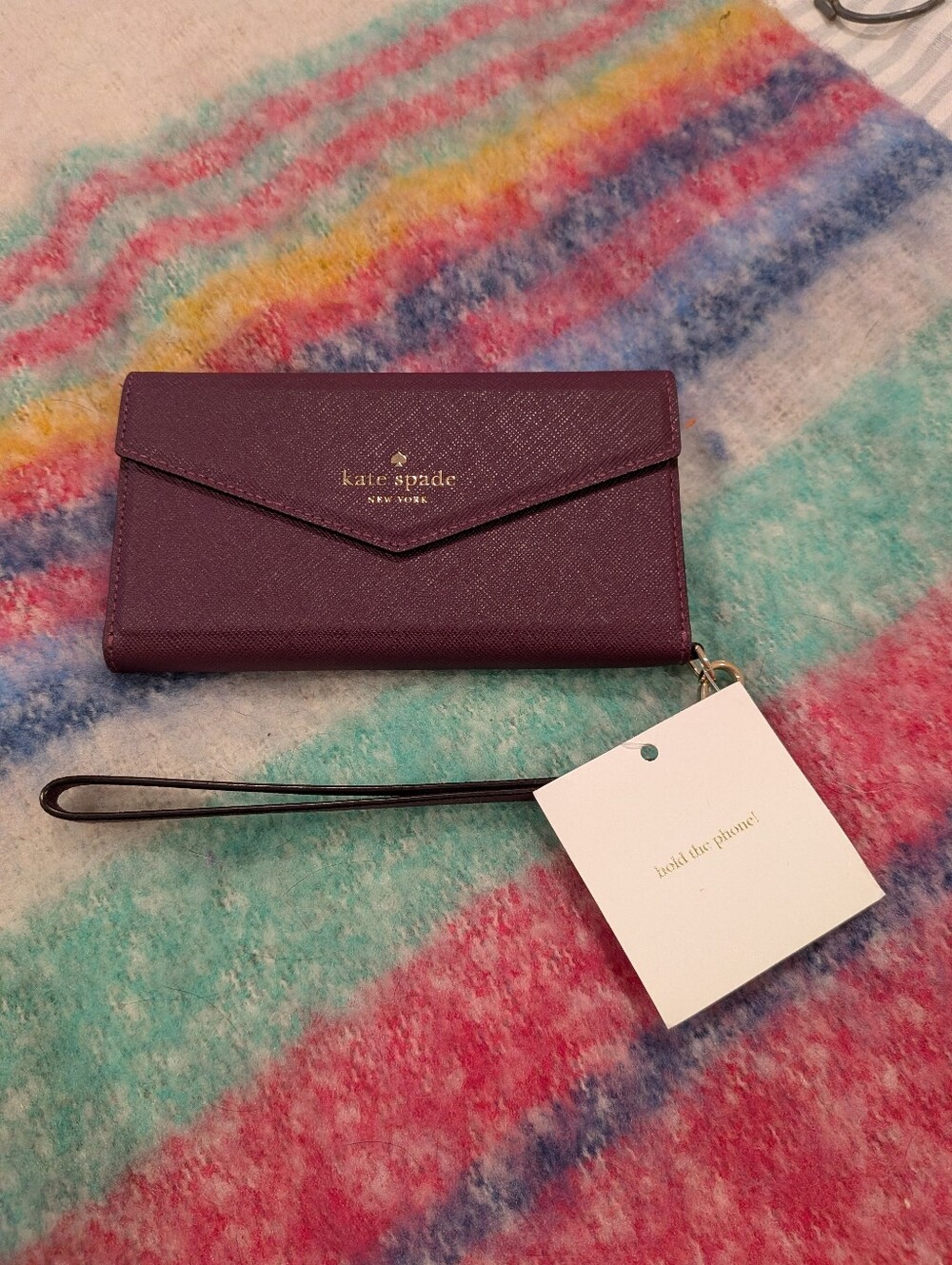 kate spade Plum Leather Wristlet Phone Case with Gold Logo